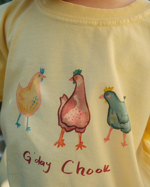Yellow shirt with colorful chicken illustrations and 'G'day Chook' text